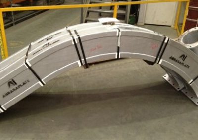 Wood chip transfer chutes internally hardfaced with AbrasaPlate