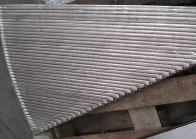 Robotically welded chipper wear parts