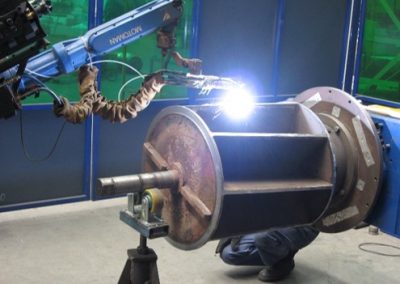 Rotary valve rotors are robotically hardfaced with tungsten carbide