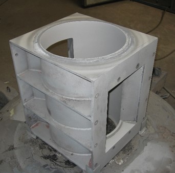 Rotary valve housing lined with tungsten carbide