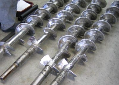 Transfer screws welded with hardfacing