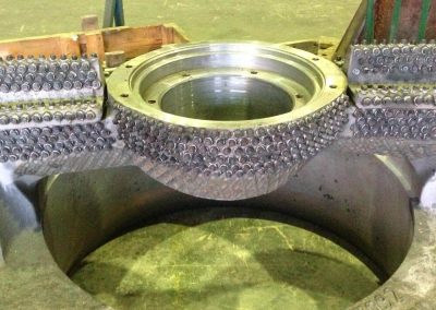 Cone crusher wear studs and hardfacing